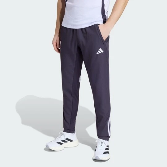 Zdjęcie produktu Spodnie reprezentacyjne Manchester United Tiro 25 Competition Adidas fioletowy