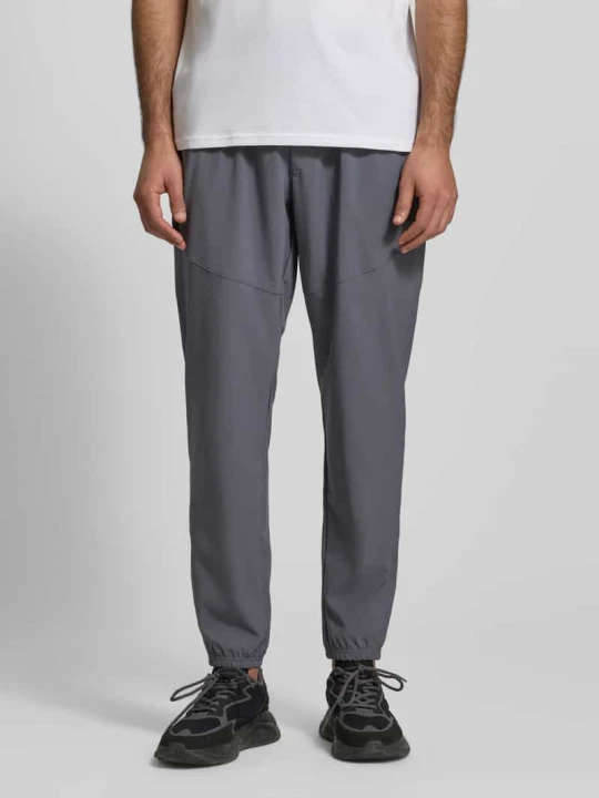 Zdjęcie produktu Spodnie jogger o kroju regular fit z nadrukiem z logo model 'Vibe' Under Armour Antracytowy
