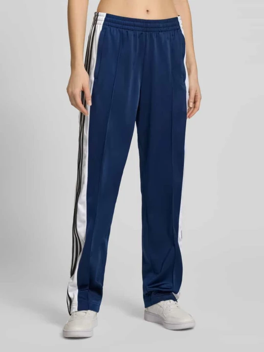 Zdjęcie produktu Spodnie dresowe o prostym kroju z elastycznym pasem Model „Adibreak” adidas Originals Ciemnoniebieski