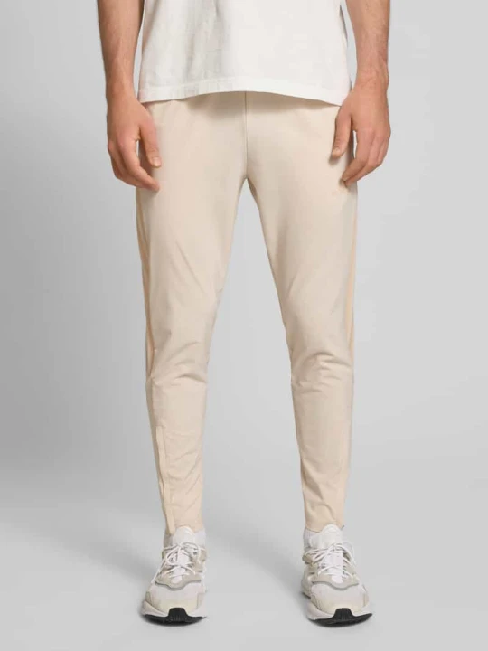 Zdjęcie produktu Jogpanty z elastycznym pasem Adidas Beżowy