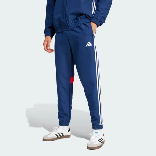 Zdjęcie produktu Spodnie Tiro 25 Essentials Woven Adidas niebieski
