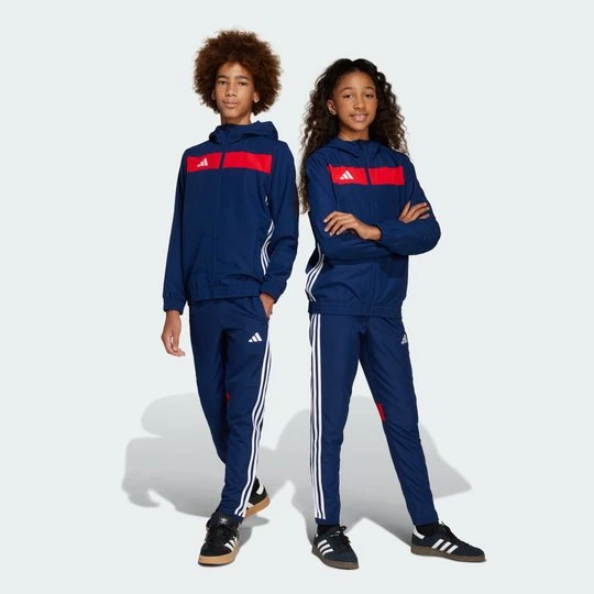 Zdjęcie produktu Spodnie Tiro 25 Essentials Woven Kids Adidas niebieski