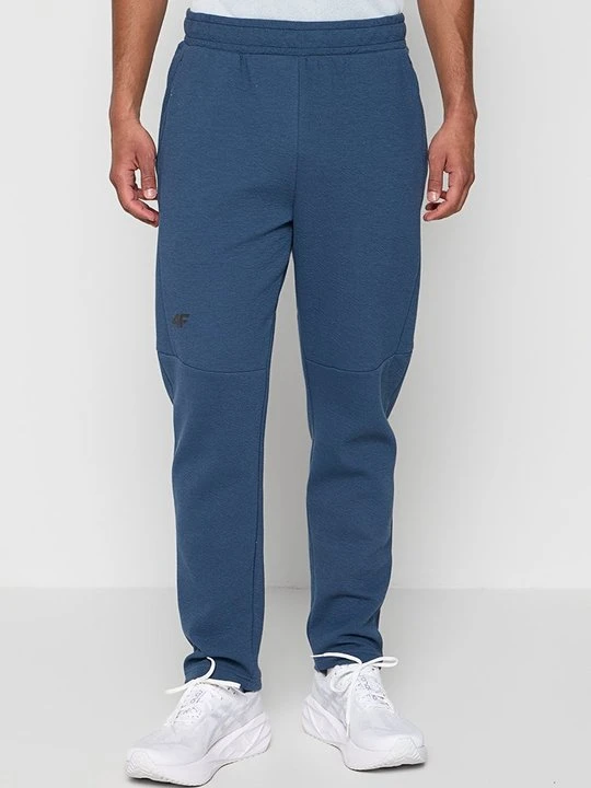 Zdjęcie produktu Spodnie treningowe 4F niebieski denim