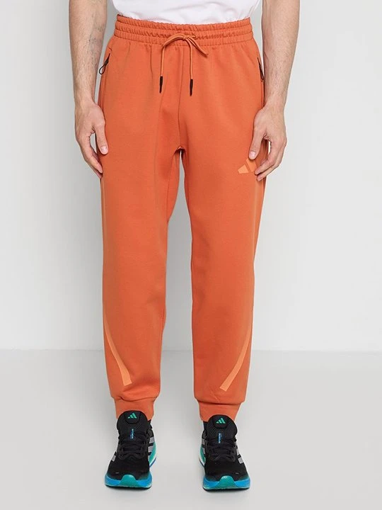 Zdjęcie produktu Spodnie treningowe Adidas pomarańczowy
