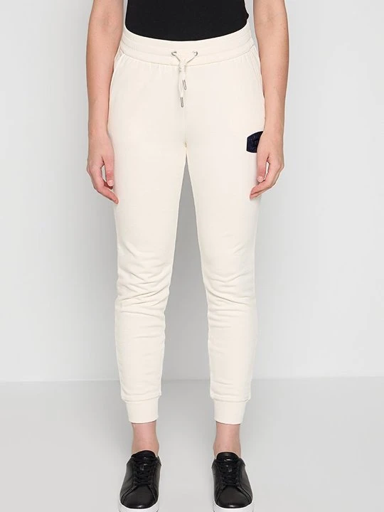 Zdjęcie produktu Spodnie treningowe Armani Exchange mleczny
