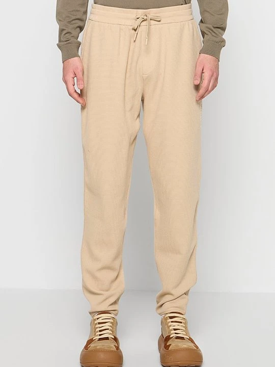 Zdjęcie produktu Spodnie treningowe Armani Exchange błękit królewski