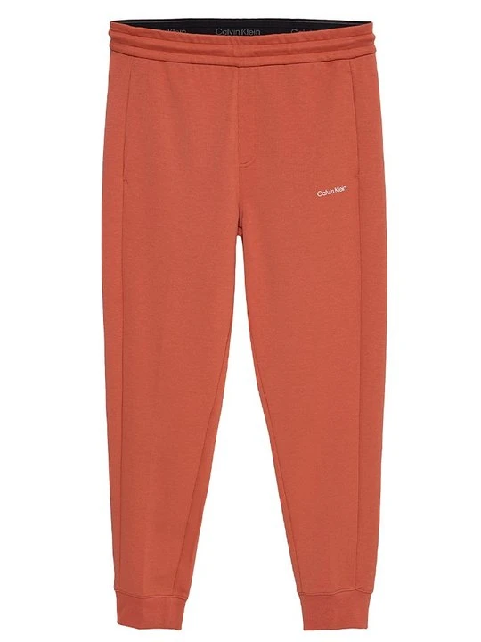 Zdjęcie produktu Spodnie treningowe Calvin Klein pomarańczowy