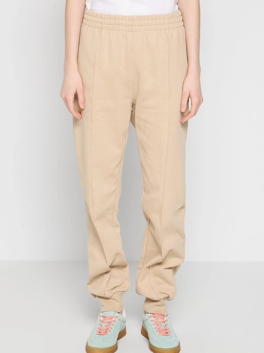 Zdjęcie produktu Spodnie treningowe DKNY beżowy