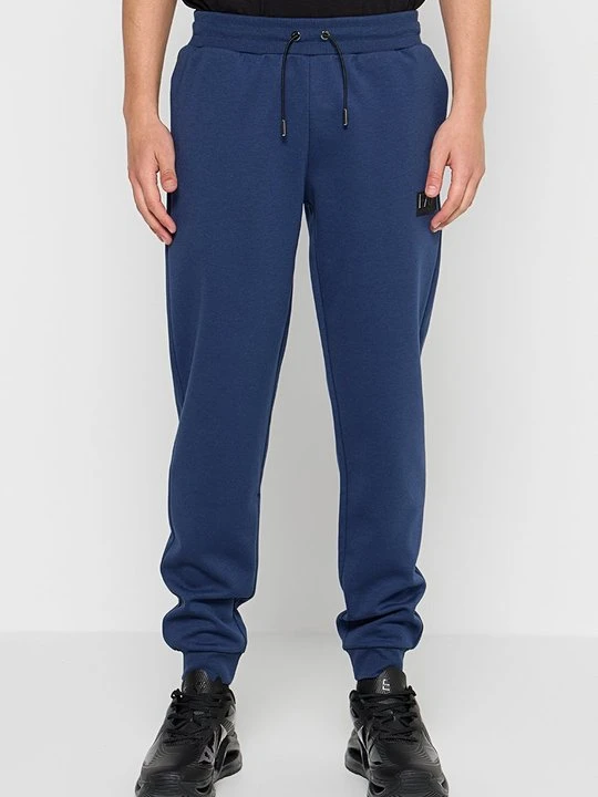 Zdjęcie produktu Spodnie treningowe EA7 Emporio Armani niebieski