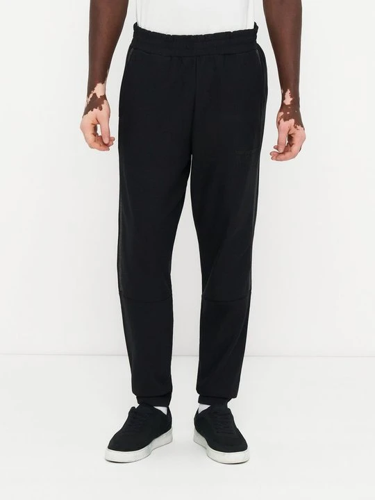 Zdjęcie produktu Spodnie treningowe EA7 Emporio Armani czarny