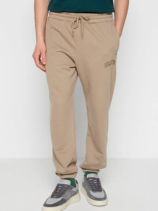 Zdjęcie produktu Spodnie treningowe Hollister Co. jasny brąz