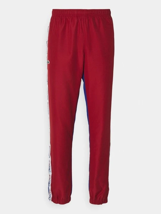 Zdjęcie produktu Spodnie treningowe Lacoste czerwony