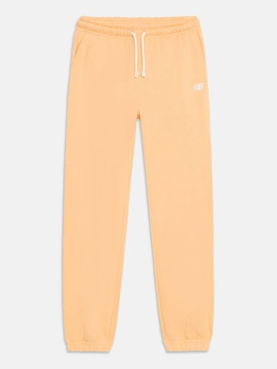 Zdjęcie produktu Spodnie treningowe New Balance morelowy