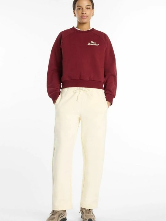 Zdjęcie produktu Spodnie treningowe New Balance morelowy