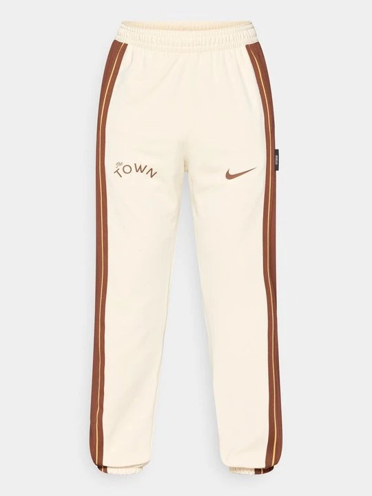 Zdjęcie produktu Spodnie treningowe Nike mleczny