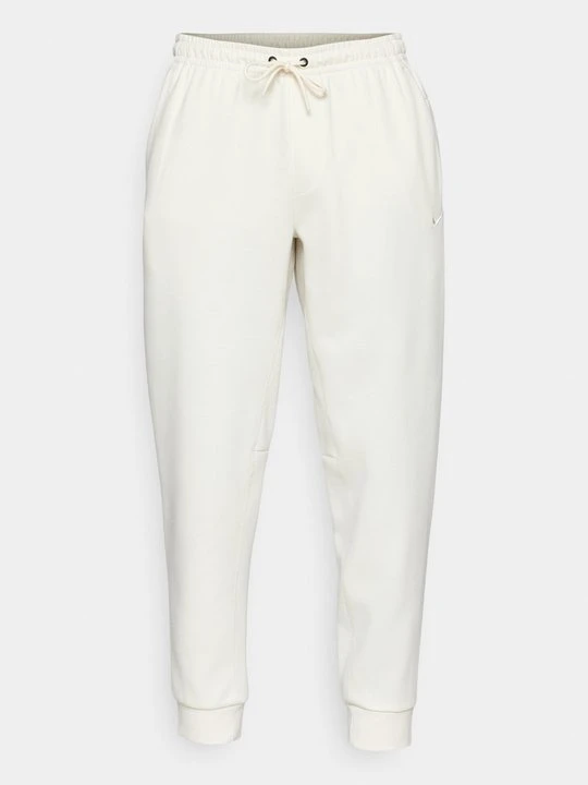 Zdjęcie produktu Spodnie treningowe Nike mleczny