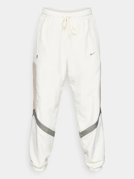 Zdjęcie produktu Spodnie treningowe Nike mleczny
