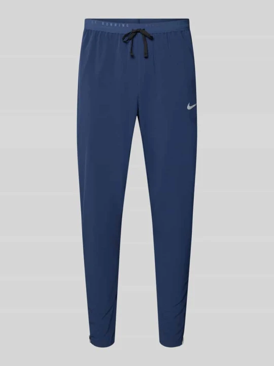Zdjęcie produktu Spodnie treningowe o kroju slim fit z technologia dri-fit model 'Stride' Nike Granatowy