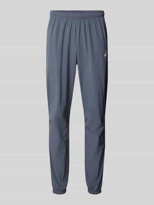 Zdjęcie produktu Spodnie treningowe o kroju straight fit z nadruk z logo model 'Core' Asics Średnioszary