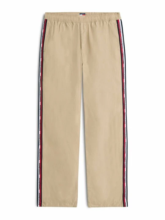 Zdjęcie produktu Spodnie treningowe Tommy Jeans w kolorze złota