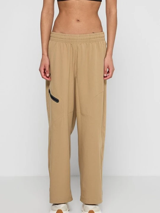 Zdjęcie produktu Spodnie treningowe Under Armour jasny brąz