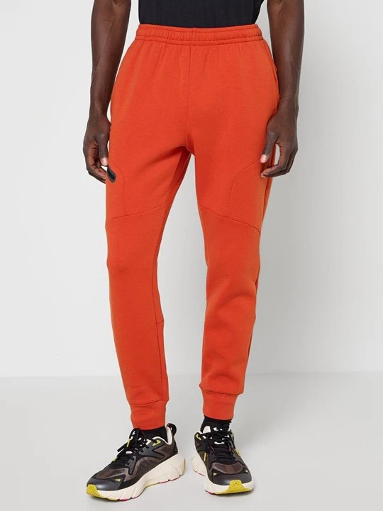 Zdjęcie produktu Spodnie treningowe Under Armour pomarańczowy