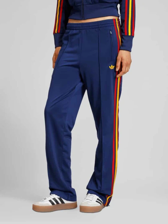 Zdjęcie produktu Spodnie treningowe z detalami z logo adidas Originals Ciemnoniebieski