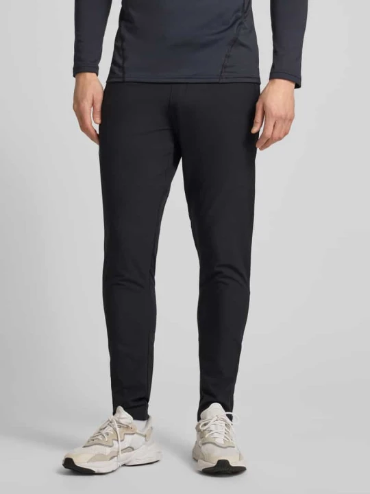 Zdjęcie produktu Spodnie treningowe z kieszeniami zapinanymi na zamek błyskawiczny Under Armour Czarny