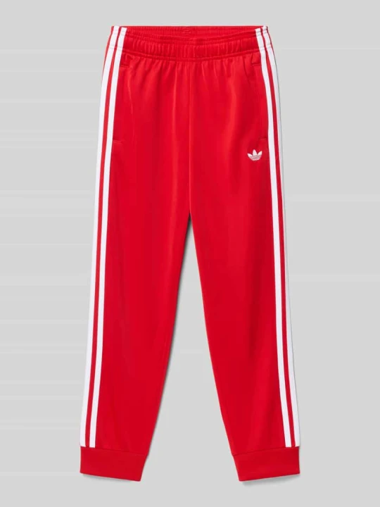 Zdjęcie produktu Spodnie dresowe z przeszyciem z logo adidas Originals Czerwony