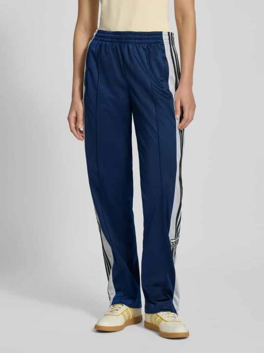 Zdjęcie produktu Spodnie typu track pants o kroju straight fit z lampasami model ‘Break’ adidas Originals Ciemnoniebieski
