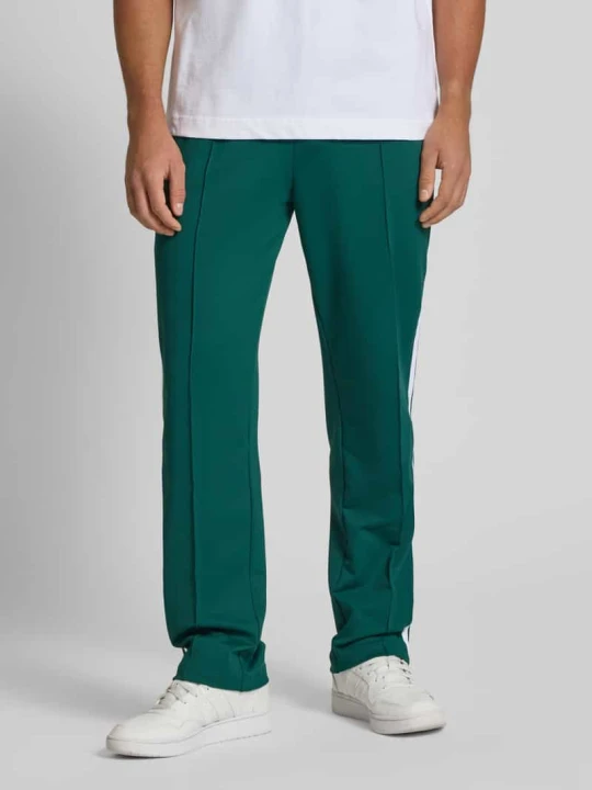 Zdjęcie produktu Spodnie typu track pants z elastycznym pasem model ‘LATUCCI’ Ellesse Ciemnozielony