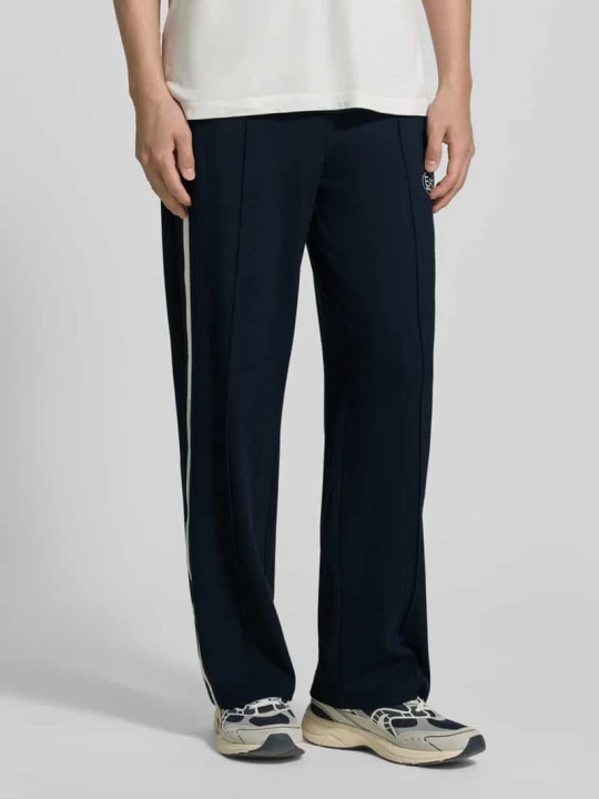 Zdjęcie produktu Spodnie typu track pants z Mieszanka wiskozy EA7 Emporio Armani Ciemnoniebieski