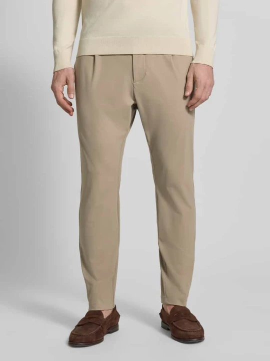 Zdjęcie produktu Spodnie w kroju slim fit z kieszeniami z lamówką na pośladkach CRUNA Beżowy