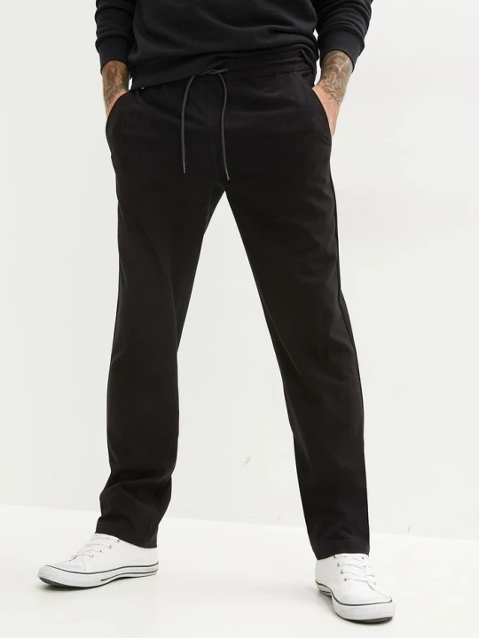 Zdjęcie produktu Spodnie z gumką w talii, ze stretchem, krój relaxed fit, straight BonPrix czarny