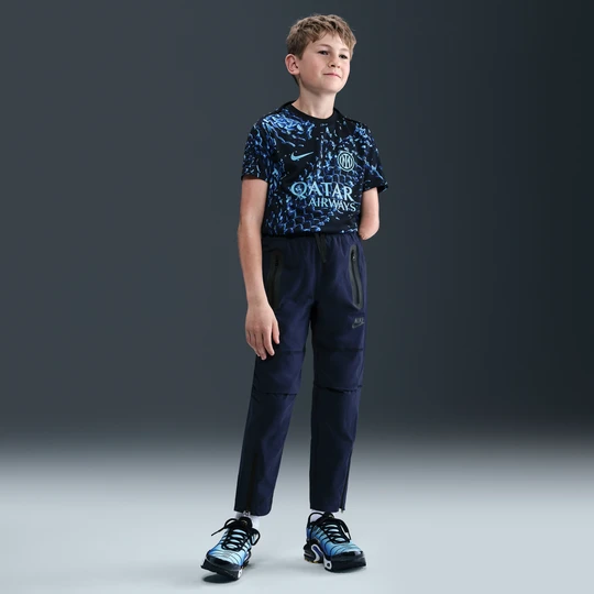 Zdjęcie produktu Spodnie z tkaniny dla dużych dzieci (chłopców) Nike Tech - Niebieski