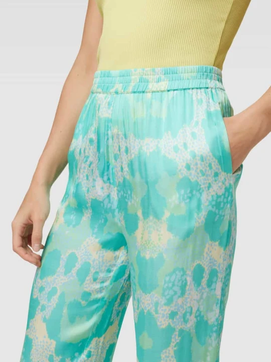 Zdjęcie produktu Spodnie z wiskozy z nadrukiem na całej powierzchni Yippie Hippie Turkusowy
