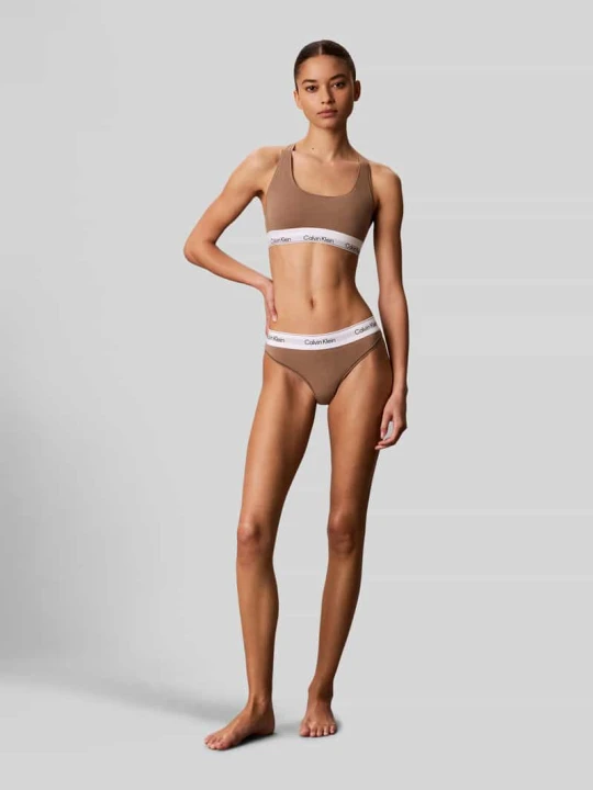 Zdjęcie produktu Stringi z mieszanka bawełny i modalu Calvin Klein Jasnobrązowy