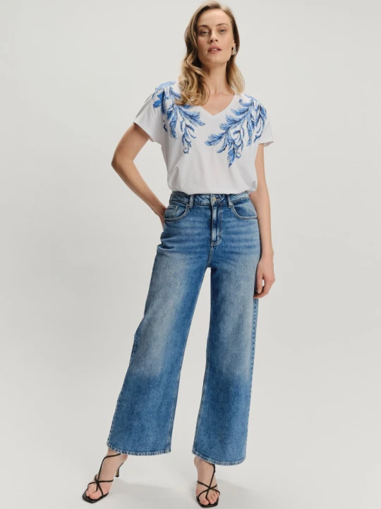 Zdjęcie produktu Stylowe jeansy z przetarciami krój wide leg Greenpoint niebieski