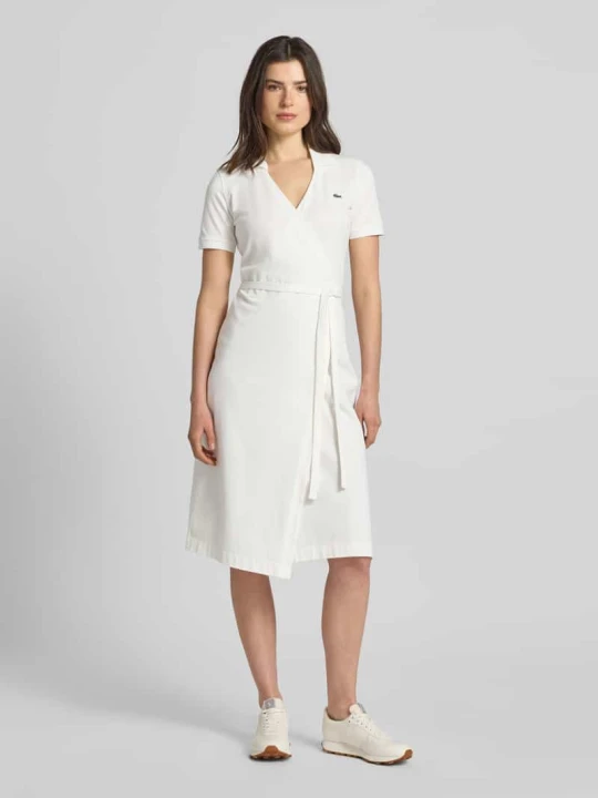 Zdjęcie produktu Sukienka kopertowa o kroju slim fit z mieszanki bawełny Lacoste Złamany biały