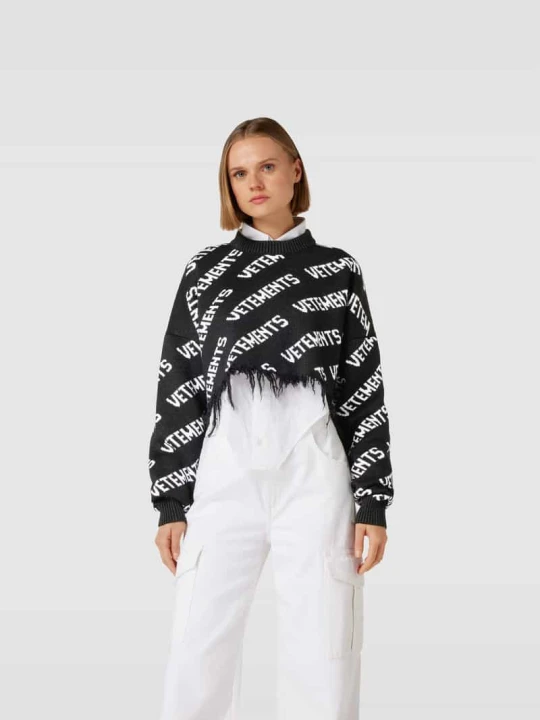 Zdjęcie produktu Sweter z logo na całej powierzchni Vetements Czarny