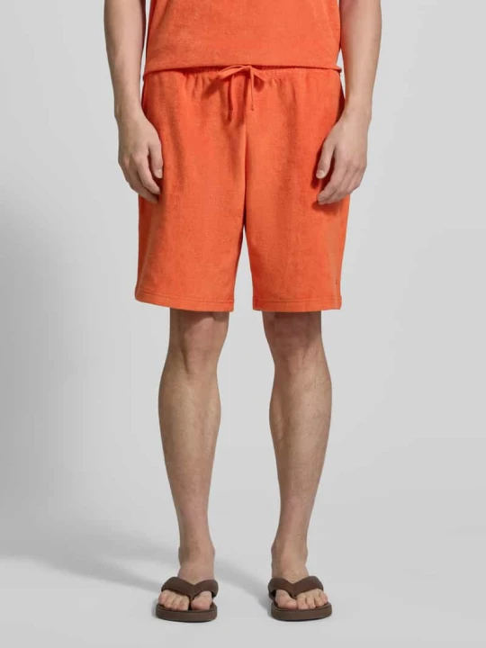 Zdjęcie produktu Szorty dresowe o kroju loose fit z czystej bawełny model 'TOWELLING SWEATSHORTS' Tommy Hilfiger Pomarańczowy