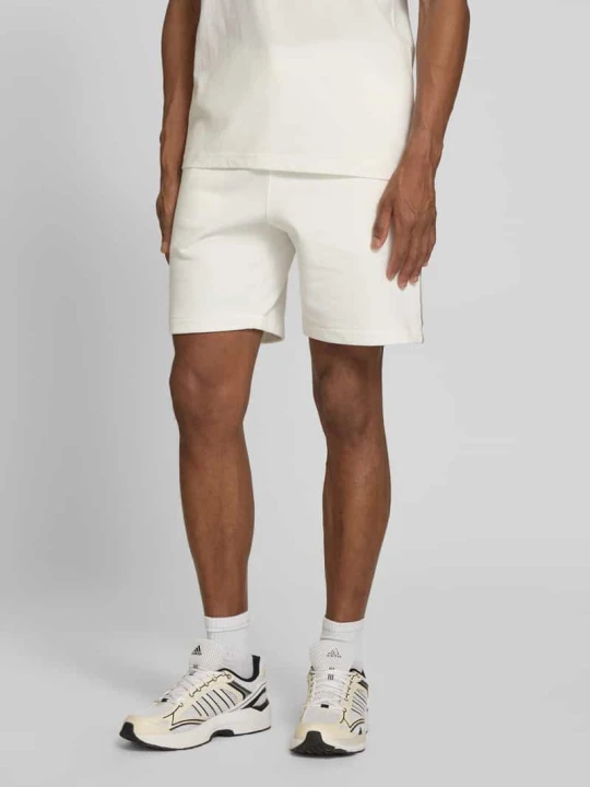 Zdjęcie produktu Szorty dresowe o kroju regular fit z czystej bawełny Lacoste Złamany biały