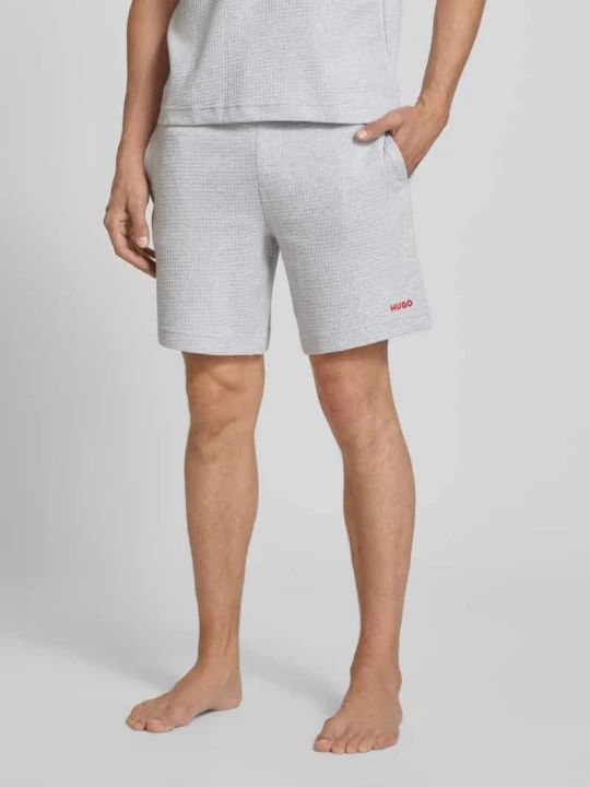 Zdjęcie produktu Szorty dresowe o kroju regular fit z mieszanka bawełny model 'AUSTIN' Hugo Średnioszary
