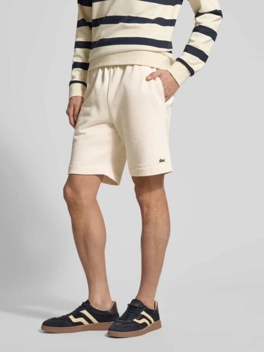 Zdjęcie produktu Szorty dresowe o kroju regular fit z mieszanki bawełny Lacoste Złamany biały