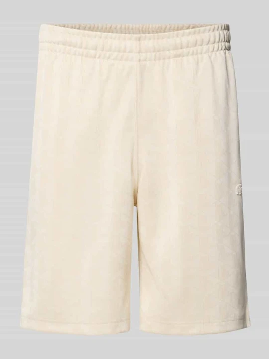 Zdjęcie produktu Szorty dresowe o kroju regular fit z nadrukiem monogramu i logo Lacoste Piaskowy melanż
