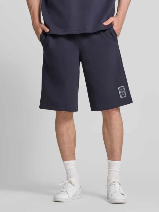 Zdjęcie produktu Szorty dresowe o kroju relaxed fit z mieszanka bawełny Lacoste Granatowy
