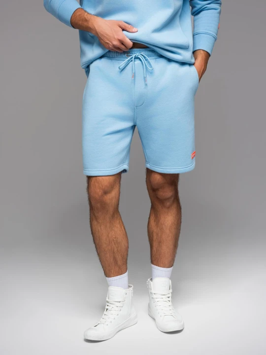 Zdjęcie produktu Szorty dresowe unisex ze ściągaczem w pasie – błękitne V8 Ombre Clothing błękitny