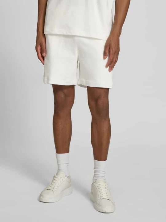 Zdjęcie produktu Szorty dresowe w kroju regular fit z czystej bawełny Lacoste Złamany biały