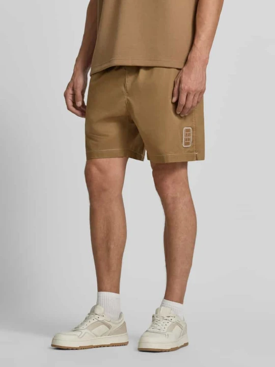 Zdjęcie produktu Szorty dresowe w kroju relaxed fit z czystej bawełny Lacoste Orzechowy
