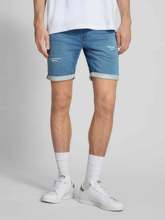 Zdjęcie produktu Szorty jeansowe o kroju regular fit z przetarciami model ‘RICK’ Jack&Jones Niebieski